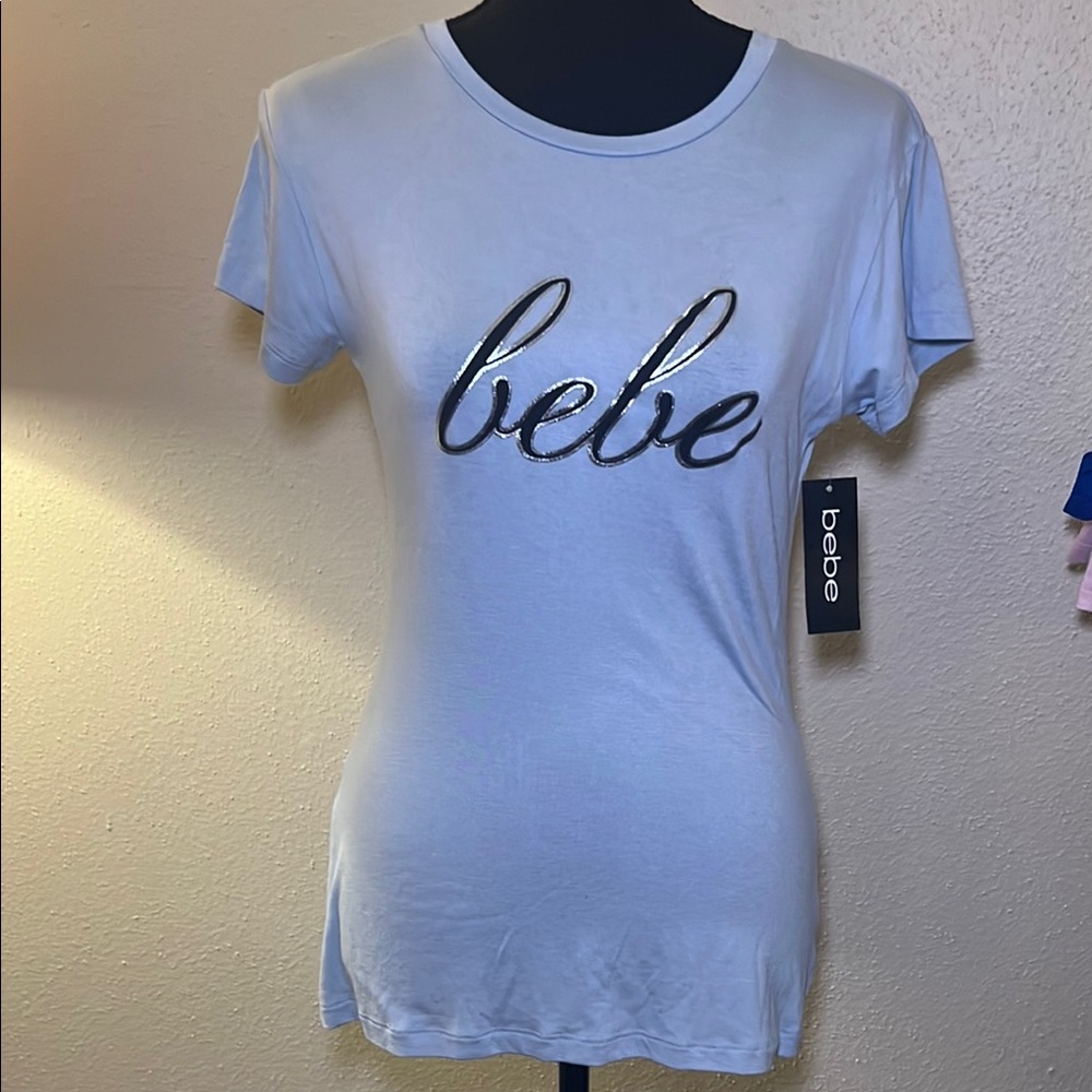 Sold in a bundle! 3 more available!
Bebe Black and White Fitted Short Sleeve Tee
